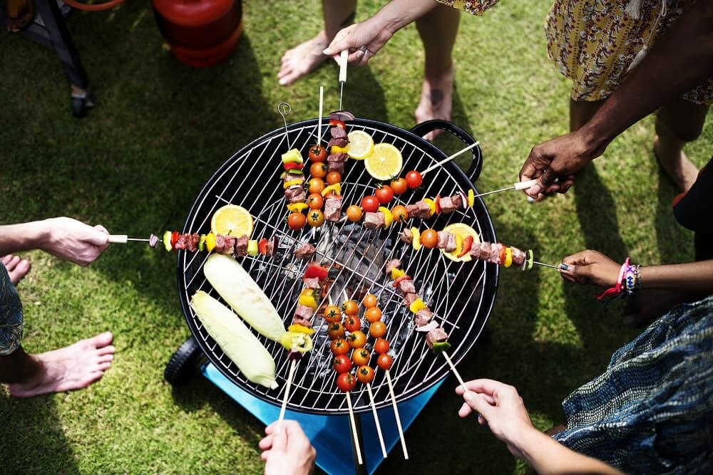grilled skewers on the bbq grill at an outdoor summer event