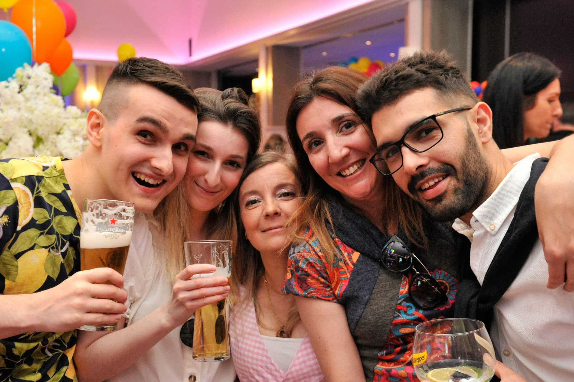 A group of young and happy Irish tech employees are enjoying themselves at a company work party in Dublin