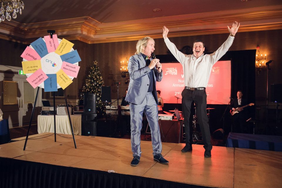 Awards are being announced by the emcee at a gala dinner and awards ceremony in Dublin