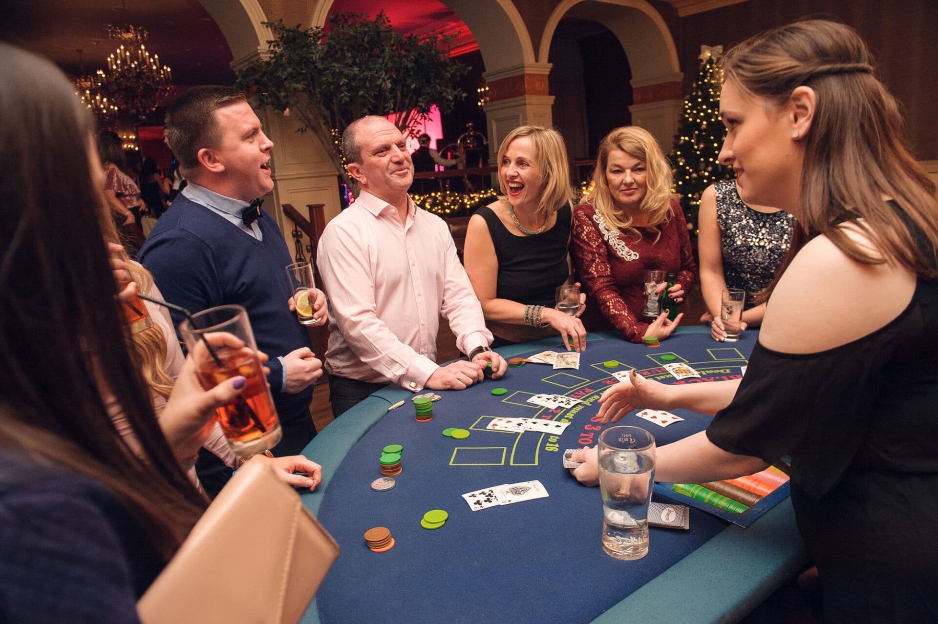 a group of employees are enjoying the blackjack table at a Vegas night themed corporate event in Dublin
