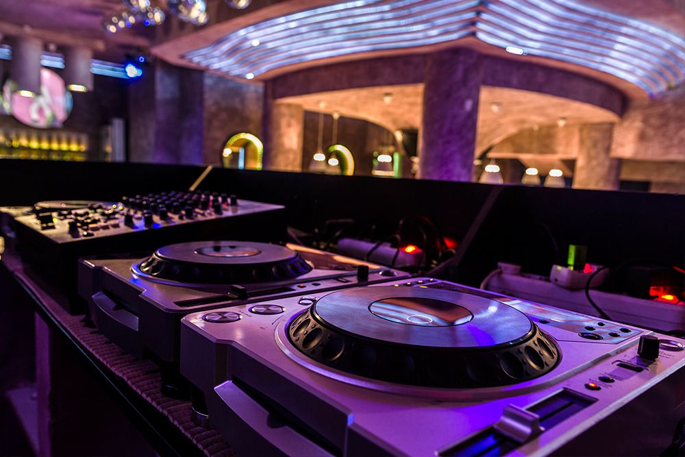the DJ booth at an indoor event