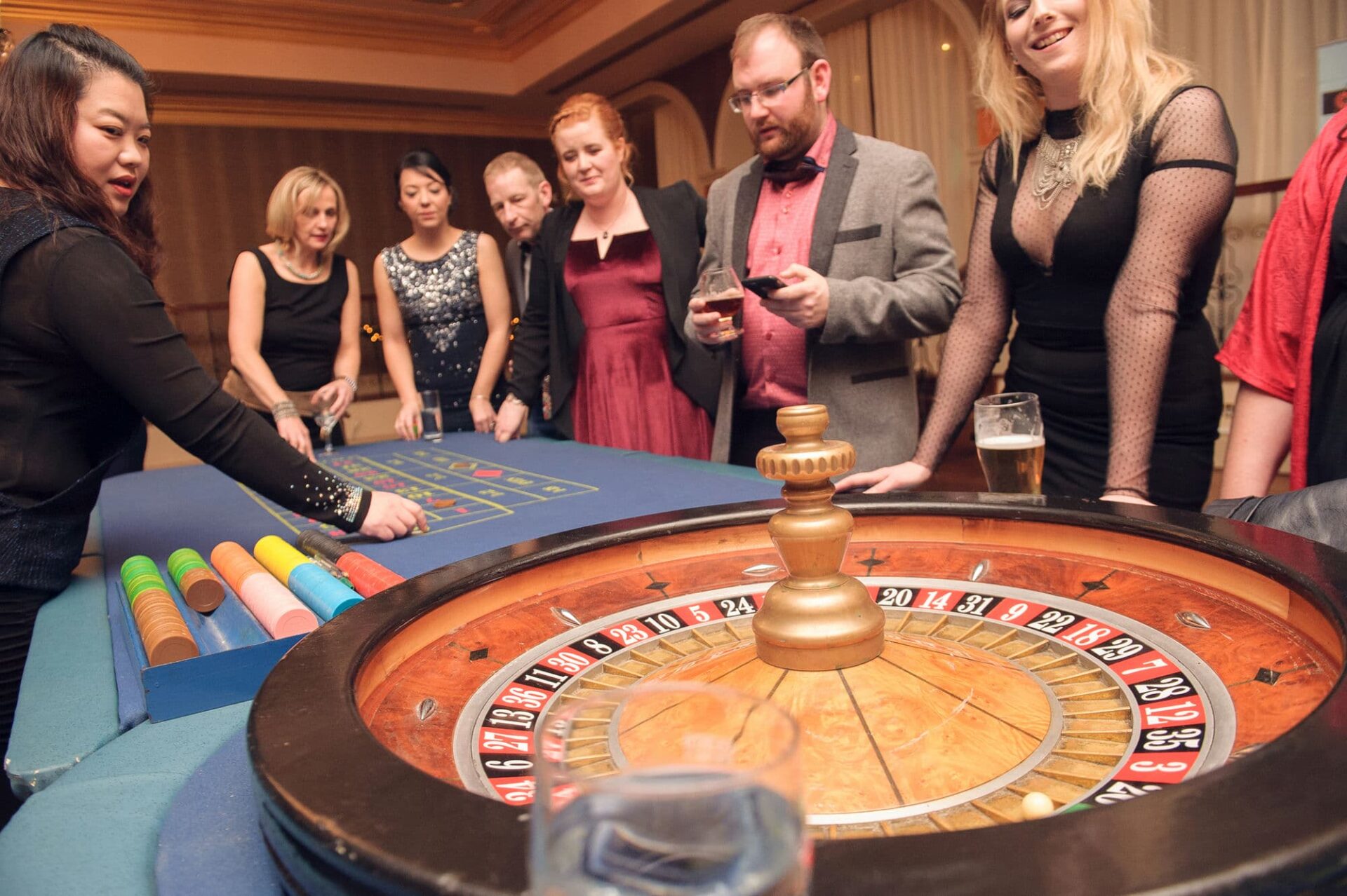 gambling at the roulette tables at a fun casino night themed event