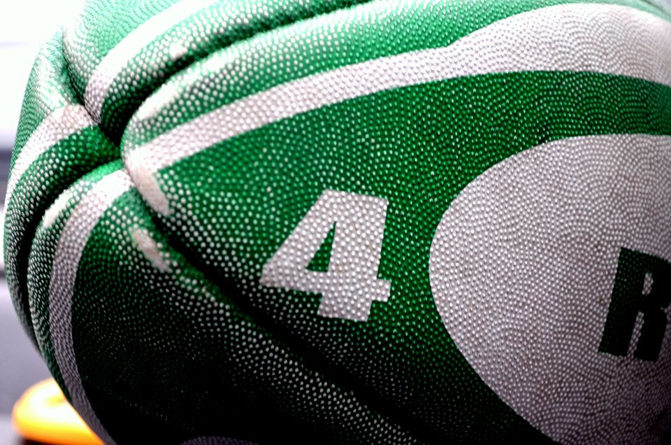 a rugby ball on the grass at a sports day event