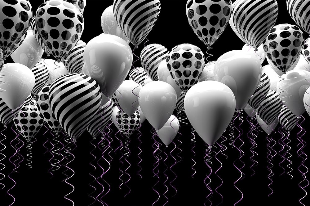 black and white balloons as part of the decorations at an indoor event