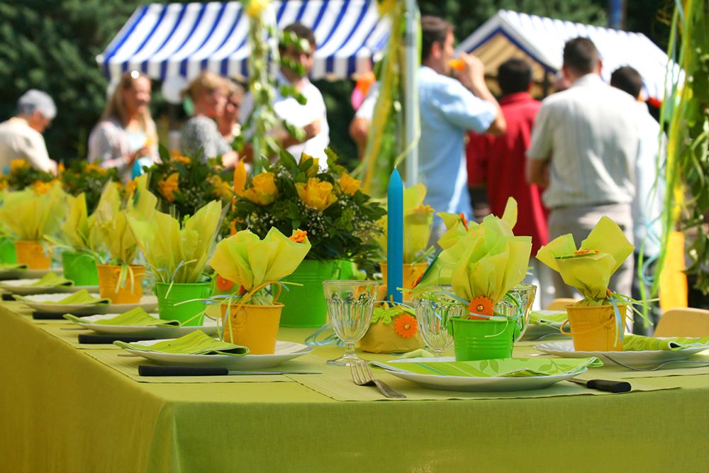 plates and assortment of items on a table and bespoke event decoration at a company event