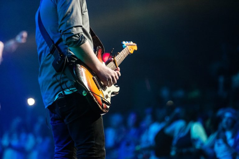 guitar player in a rock band entertains at a corporate function