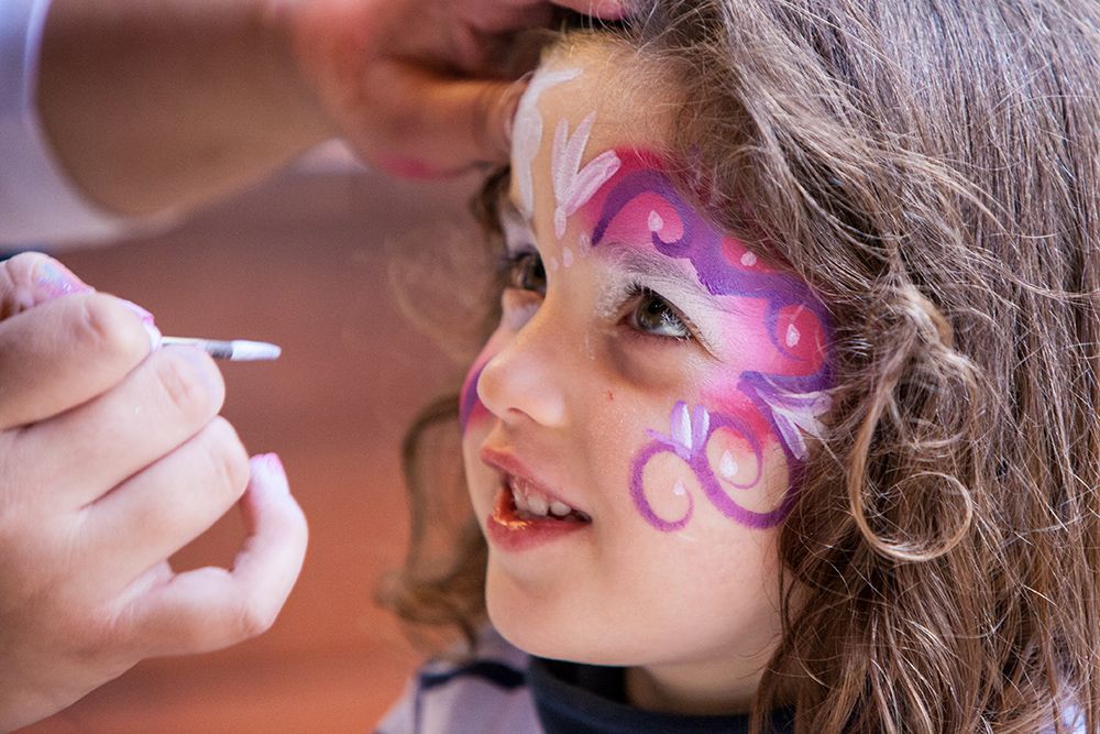 happy young girl with face paint