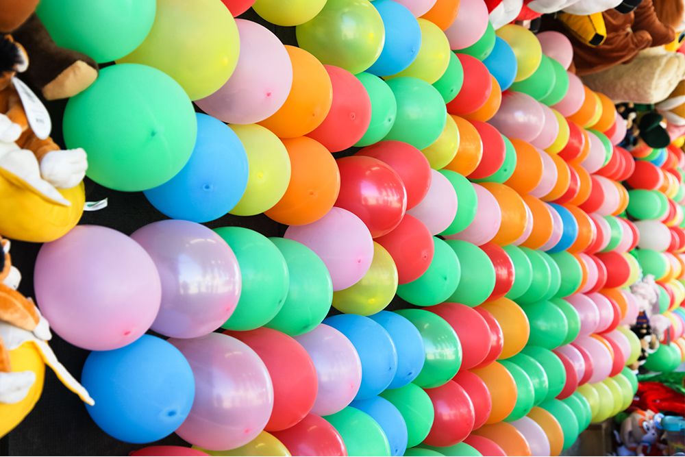 Balloons mounted and ready to be popped at a carnival
