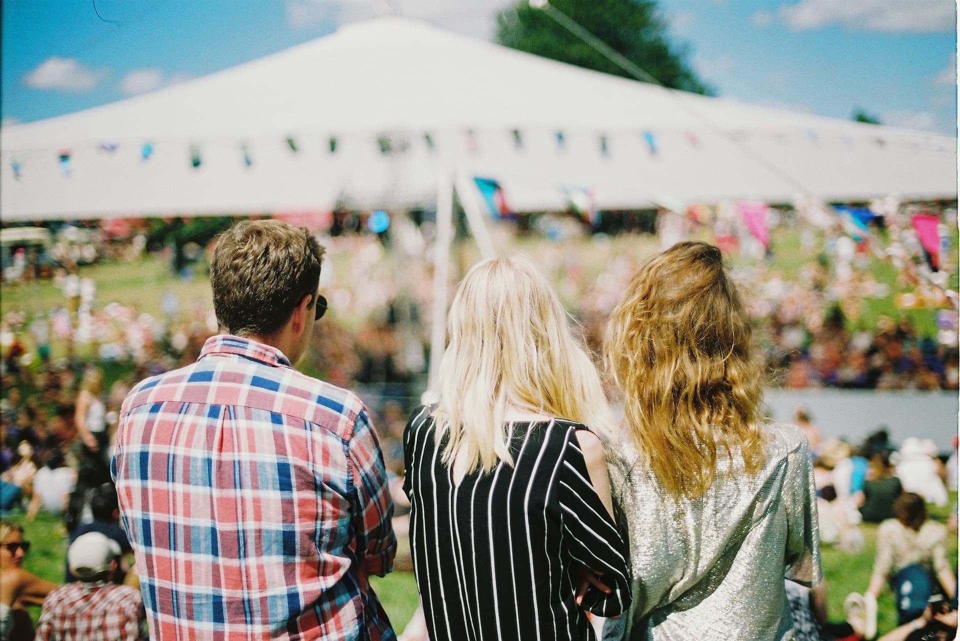 festival attendees at a large outdoor festival event